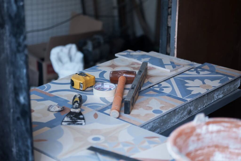 Bathroom being renovated with tiles and tools